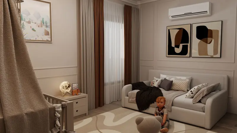 A toddler sits on a soft rug in a stylish nursery with modern art and warm tones