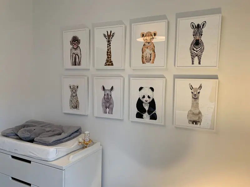 Adorable animal prints adding charm to a minimalist nursery wall decor